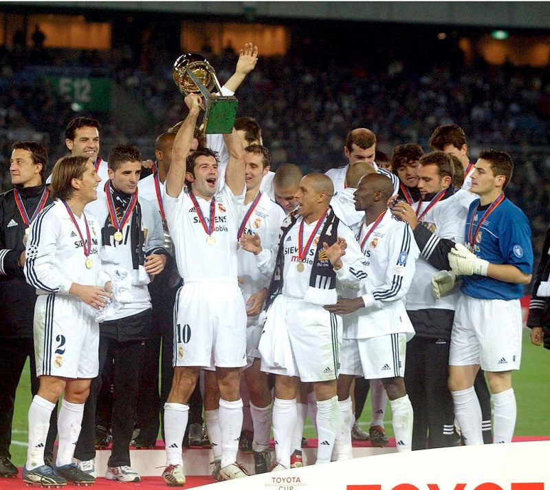 Luis Figo of Real Madrid lifts the trophy