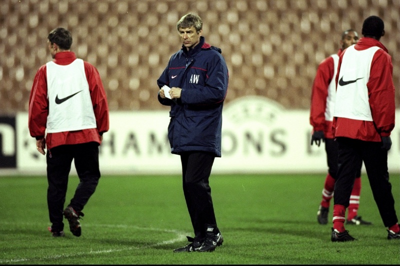 The Arsenal coach Arsene Wenger watches over his players